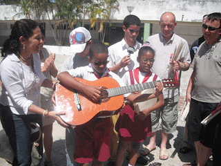 Donating a guitar to the Abel Santamaria School for Visually Impaired Children in Havana