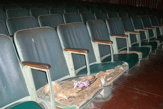 Rain damaged chairs inside the theatre