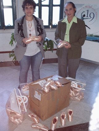 The director of the Cuban National Ballet shoes receiving shoes sent by the Royal Ballet