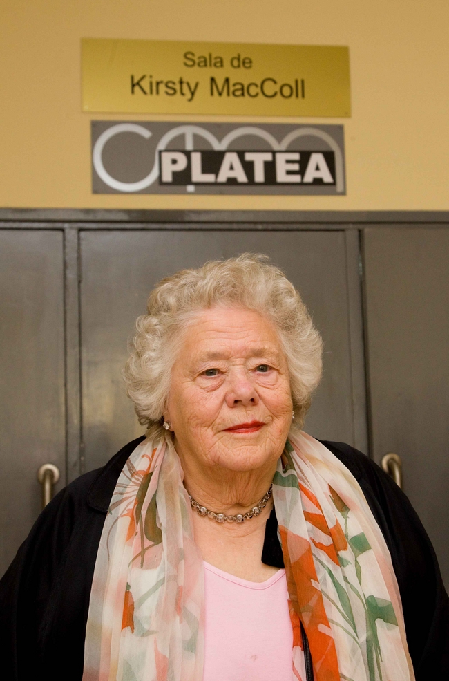 Jean McColl in front of the entrance to the Kirsty McColl auditorium at the Miramar Theatre