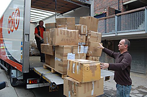 Picture caption: Rob Miller, Music Fund Director loads the boxes of ballet shoes and instruments ready to send to the airport.