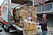 Picture caption: Rob Miller, Music Fund Director loads the boxes of ballet shoes and instruments ready to send to the airport.