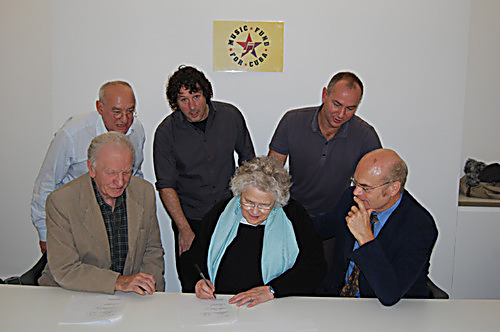 Music Fund trustees, Ken Gill, Mike Seifert, Nick Gold, Jean MacColl, Michael Chambers, and Director Rob Miller sign the terms of reference for the Miramar Theatre project.