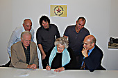 Music Fund trustees, Ken Gill, Mike Seifert, Nick Gold, Jean MacColl, Michael Chambers, and Director Rob Miller sign the terms of reference for the Miramar Theatre project.